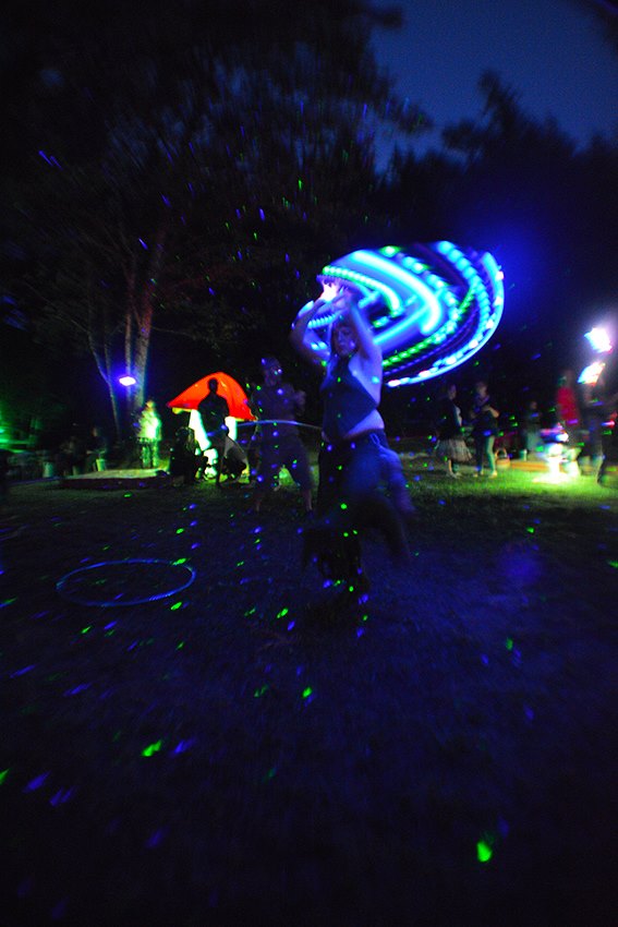 night scene with hoopers, dancers and decor